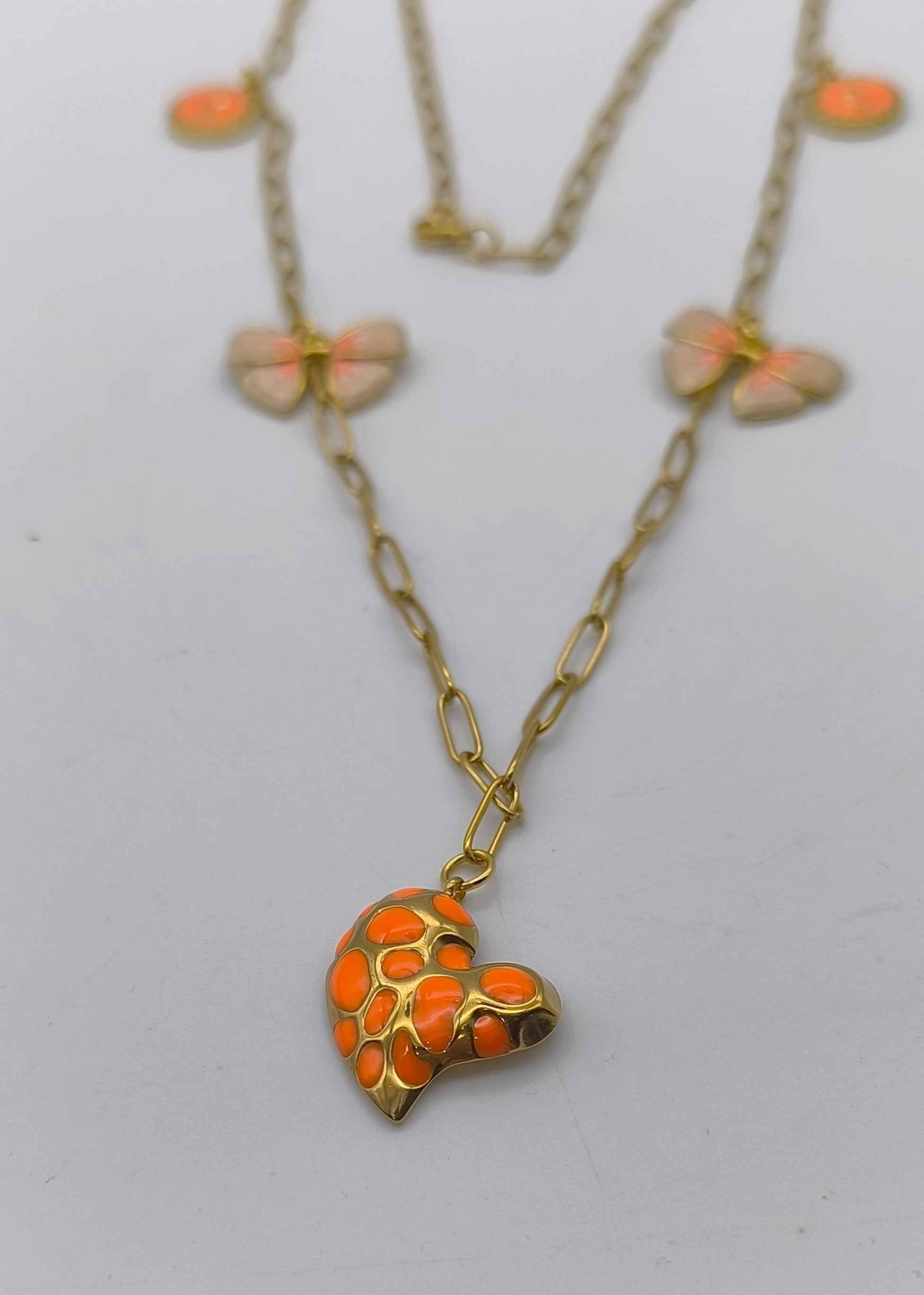 Halskette lang mit verschiedenen Charms goldfarben/orange