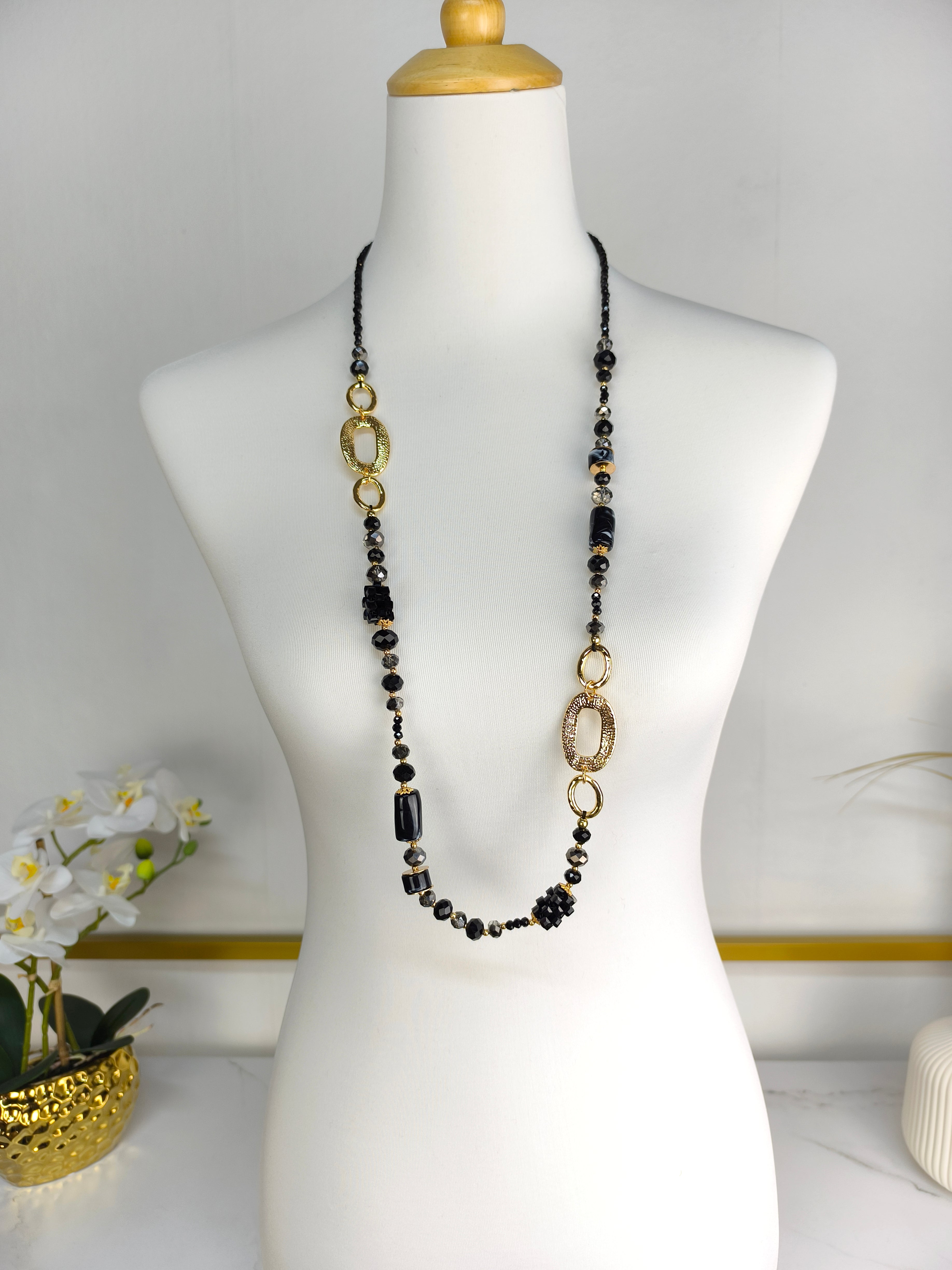 Lange Perlenkette schwarz/gold