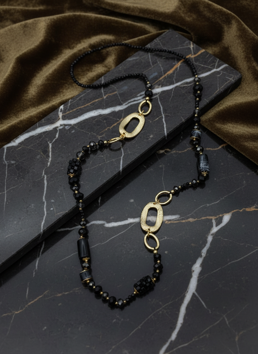 Lange Perlenkette schwarz/gold
