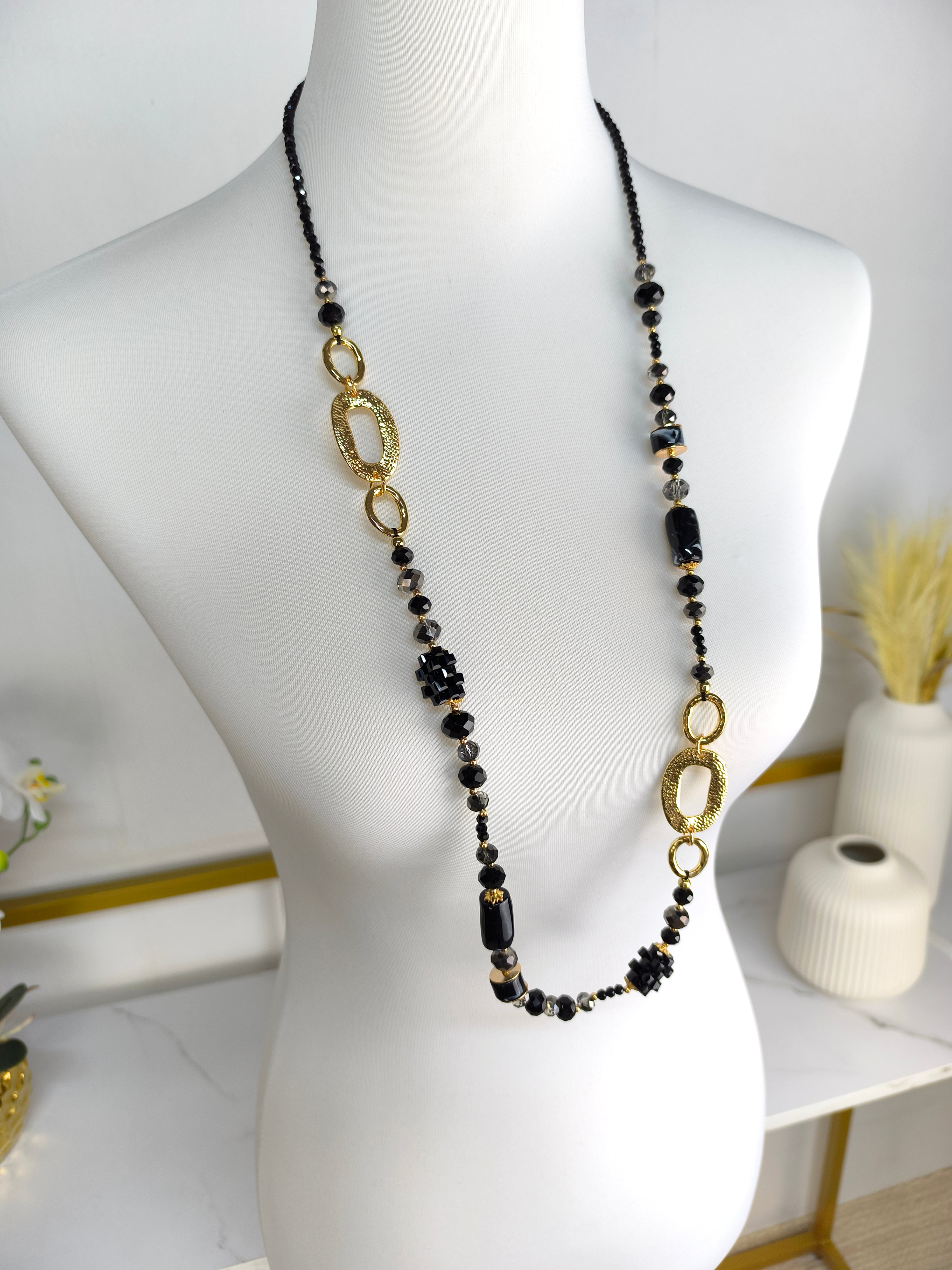 Lange Perlenkette schwarz/gold